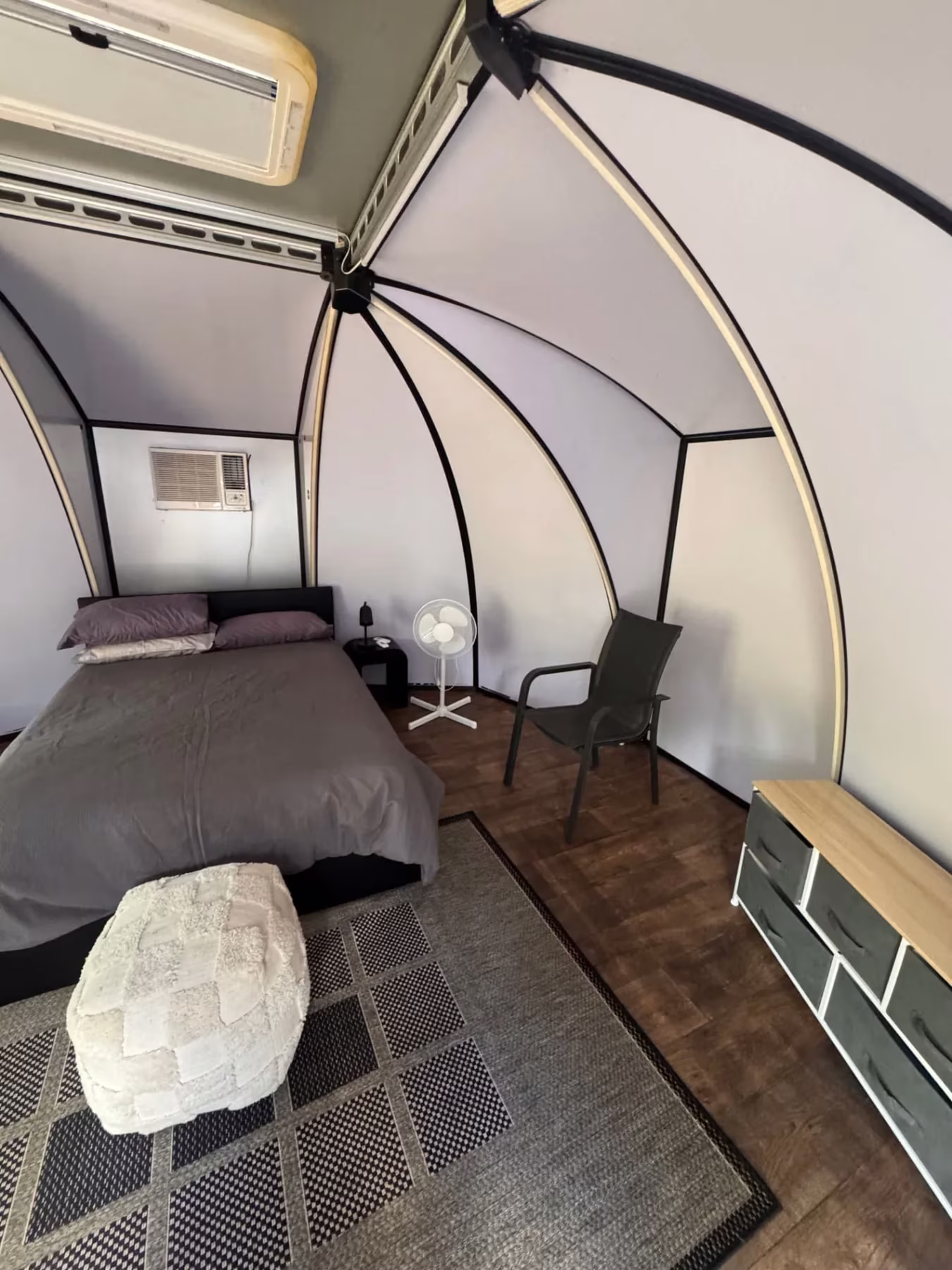 Pod interior with drawers, fan and chair
