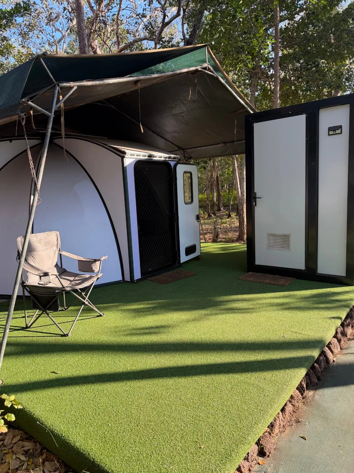 Pod entry with camp chair under the awning