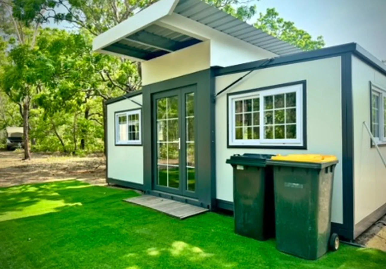 Cabin quarters with turf surrounds at camp