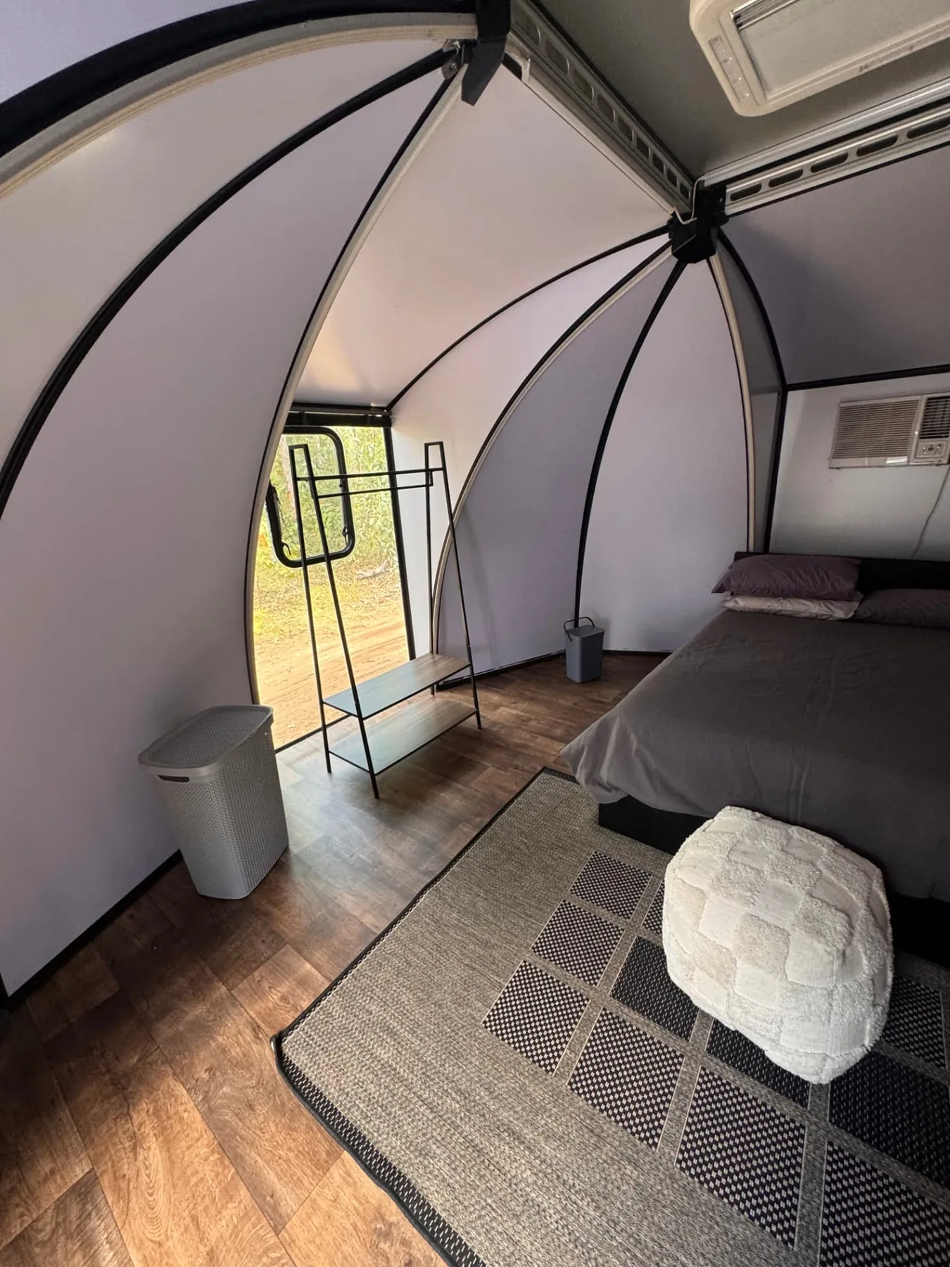 Pod interior with hanging rail and shelving
